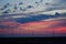 Windmills against a rainbow evening sky