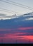 Windmills against a rainbow evening sky