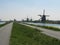 Windmills along a broad channel in Kinderdijk, the netherlands in springtime