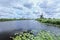 Windmills on a canal with dramatic shaped clouds