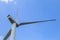 Windmills for electricity generation. Green energy concept. Background with copy space. Huge blades close up