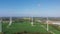 Windmills in field