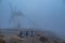 Windmills in the fog in Consuegra town in Spain