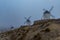 Windmills in the fog in Consuegra town in Spain