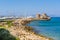 Windmills and the fort of St. Nicholas in the port of Mandraki in Rhodes. Greece