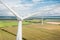 Windmills generate electricity in the fields. Alternative sources of energy, Wind turbines close-up from a height. Nice view from