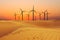 Windmills generating alternative green energy in the sand dessert