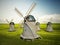 Windmills on the green field. 3D illustration