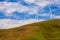 Windmills on a Green Hill