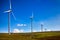 Windmills on green meadow. Spain