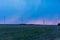 Windmills during a heavy storm. Very strong wind