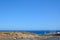 Windmills near the blue sea