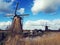 Windmills over blue sky in kinderdijk