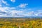 The Windmills park of Paldiski. Wind turbine farm near Baltic sea. Autumn landscape with windmills, orange forest and