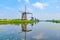 The windmills and the reflection on water in Kinderdijk in Rotterdam, Netherlands