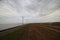 Windmills in a row along a of the IJsselmeer close to lelystat at the Ketelmeer in the Netherlands.