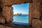 Windmills and saint Nicholas fortess in town Rhodes. View from window in the walls. Rhodes island in Greece