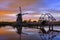 Windmills at twilight after sunset in the famous kinderdijk, Netherlands