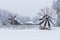 Windmills in Village Museum during snowy winter