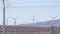 Windmills on wind farm, wind mill energy generators. Desert windfarm, USA.