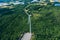 Windmills, wind turbines. Aerial view of windmills in green summer forest in Finland