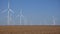 Windmills, wind turbines, agriculture wheat field generator power, electricity