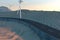 Windmills and winding road in the open, 3d rendering