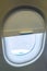 The window of the airplane. A view of porthole window on board an airbus for your travel concept or passenger air transportation