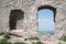 Window, alcove and hole in wall of antique building made of stone