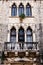 Window with balcony, sculptures, arches