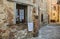 Window with bars in the old house of the city of Montepulciano,