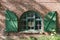 Window in a brick farmhouse with shutters in Schleswig Holstein, Germany