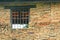 Window on brick wall at Phra that lampangluang temple,Thailand