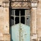 Window with a broken glass in an ancient building