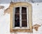 Window In Building In Lagos Portugal With Lady In Prayer