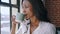 Window, business and black woman with coffee, thinking and relax for planning. Jamaican lady, female entrepreneur and