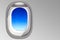 Window cabin of airplane and blue sky concept for transportation and travel around the world