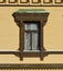 window with carved cornice on the wall of an old wooden house on a sunny winter day in russia. late 18th century. Spring is coming