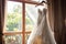 Window charm Wedding dress on a curtain rail, near a window