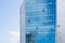 Window cleaner working on a glass facade suspended