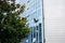 Window cleaner working on a glass facade suspended