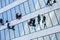 Window Cleaners wash the glass facade. Industrial climbers wash the Windows of a modern skyscraper.