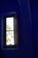 Window in cobalt blue room