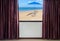 Window with curtains and blinds looking out the window frame meet seaside view