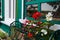 Window decorated with flowers. Cottage exterior with selective focus