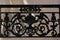 Window with decorative railing from black smithery iron