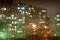 Window with drops of night rain in a city