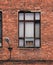 Window on the facade of an old brick building. Loft-style architural