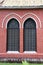 Window frame and red brick of exterior of main church at cathedral of the holy trinity.