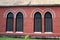 Window frame and red brick of exterior of main church at cathedral of the holy trinity.